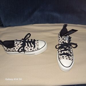 Stylish Leopard Print Beige and Black Sneakers with laces.